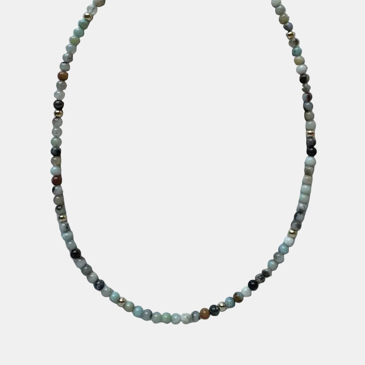 Beaded necklace on a marble surface
