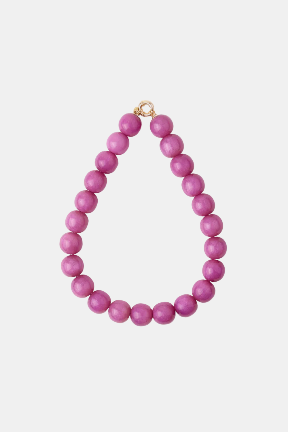 A beaded necklace made of matte magenta-purple round beads, arranged in a teardrop shape with a small gold clasp at the top, shown on a plain white background.