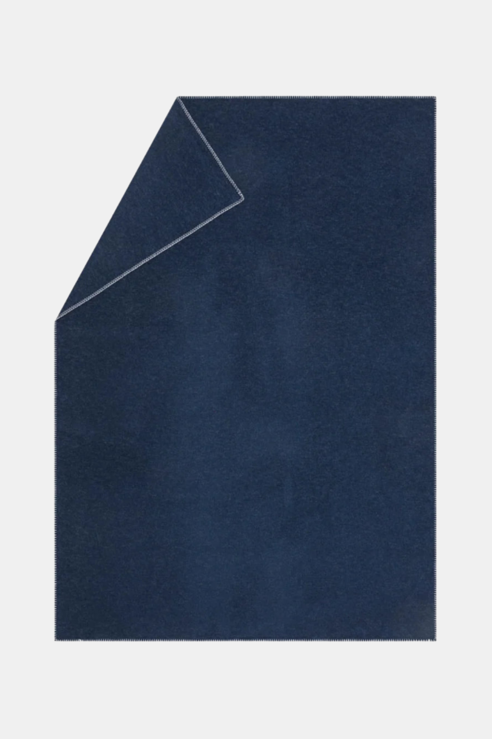 A dark navy blue rectangular sheet or panel with a folded top-left corner, shown on a plain light gray background.
