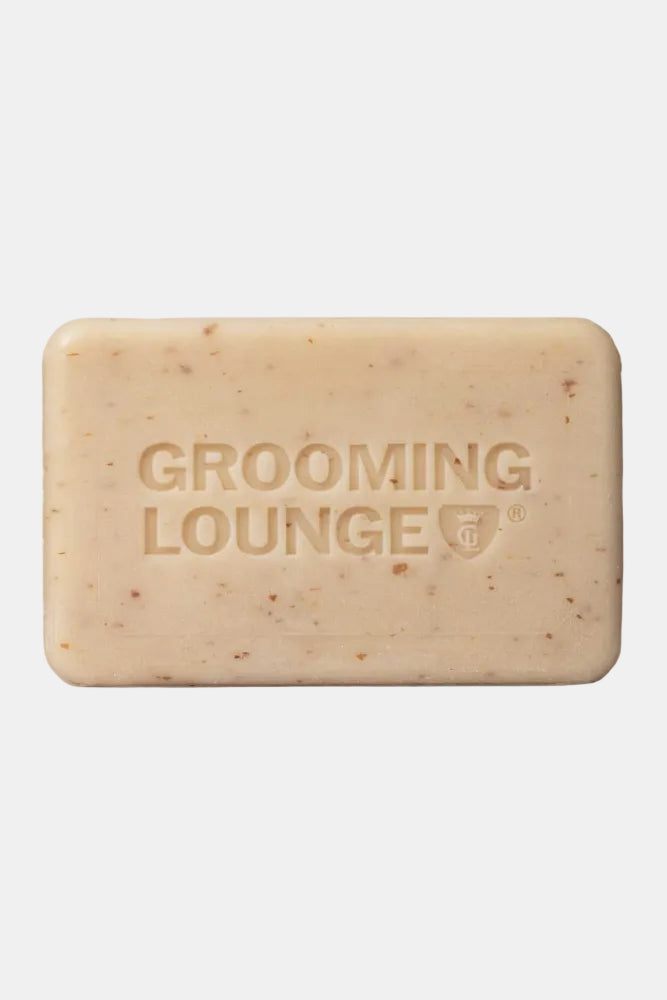 Bar of soap with 'Grooming Lounge' branding on a white background