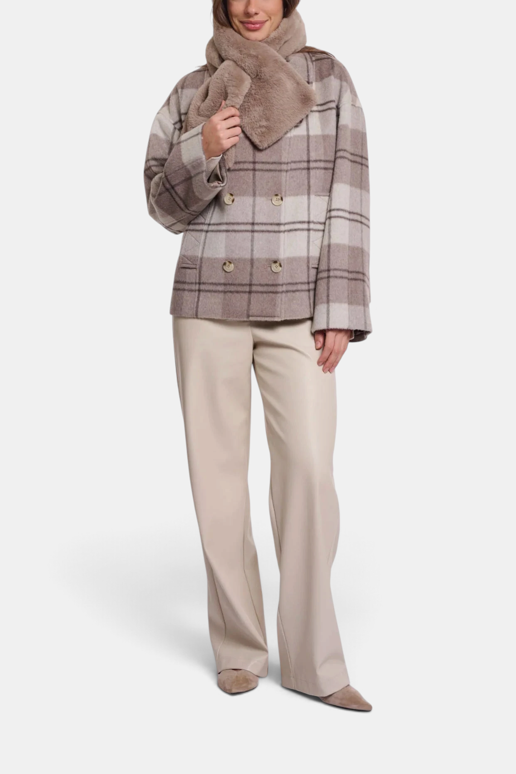 The Copper Shed Stip taupe faux fur scarf worn over a plaid coat with an open loop detail for a secure fit.
