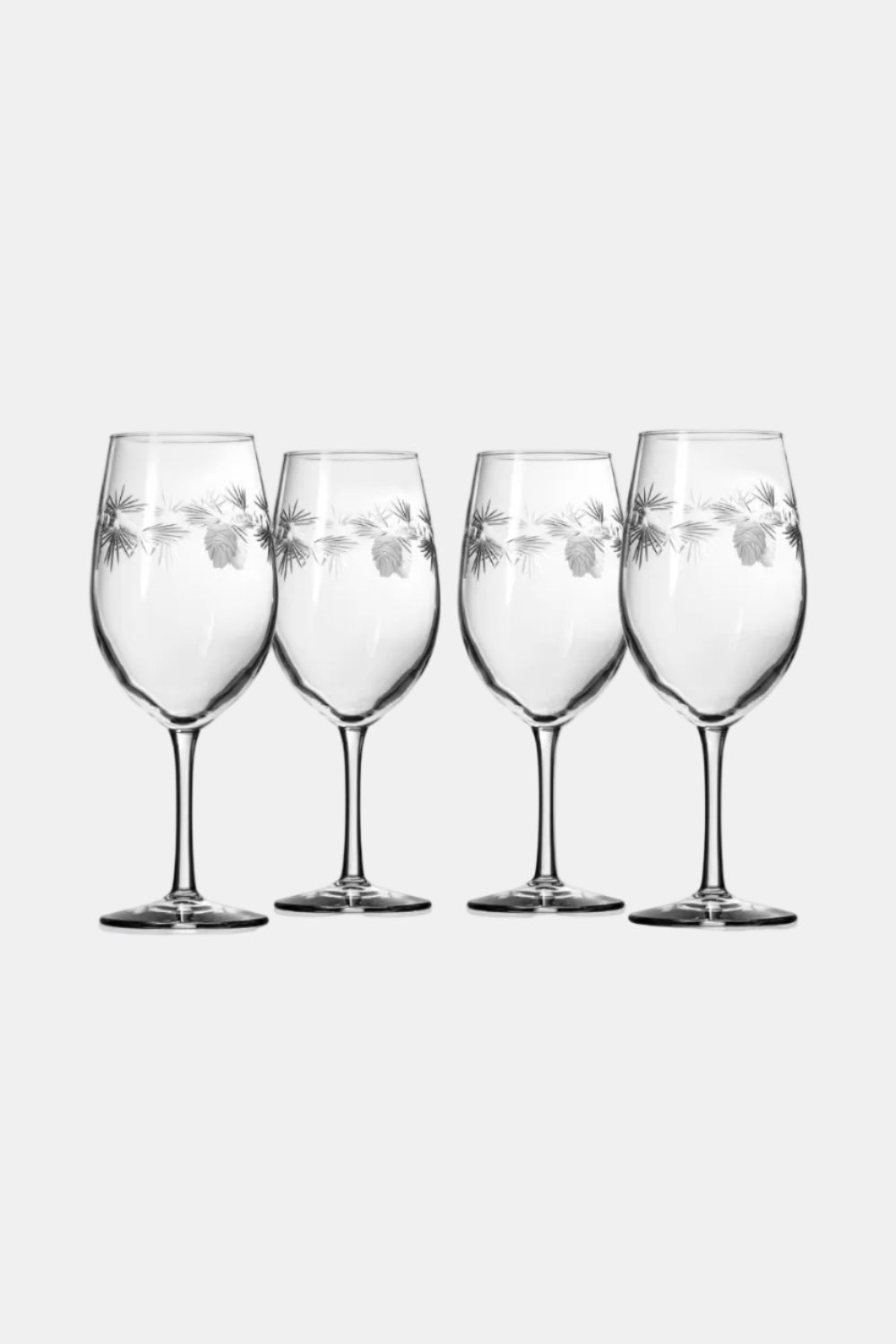 Four wine glasses with floral etching on a white background