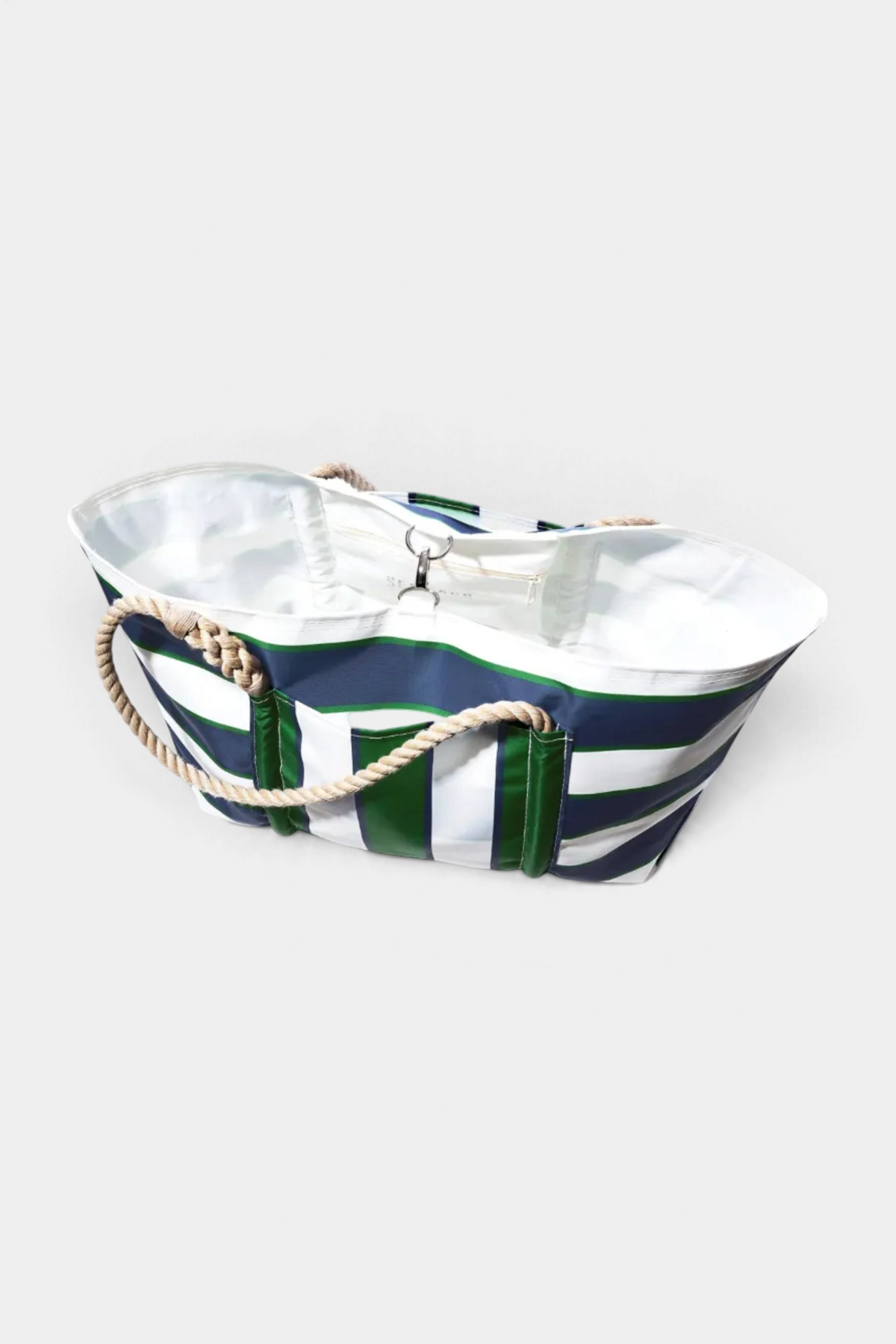 Striped bag with green, white, and navy pattern on a white background