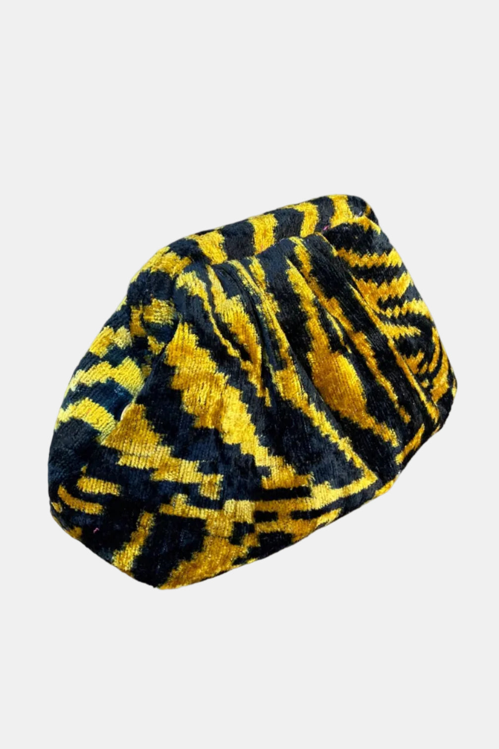 A knit beret hat featuring a bold yellow and black geometric pattern, shown against a plain white background.