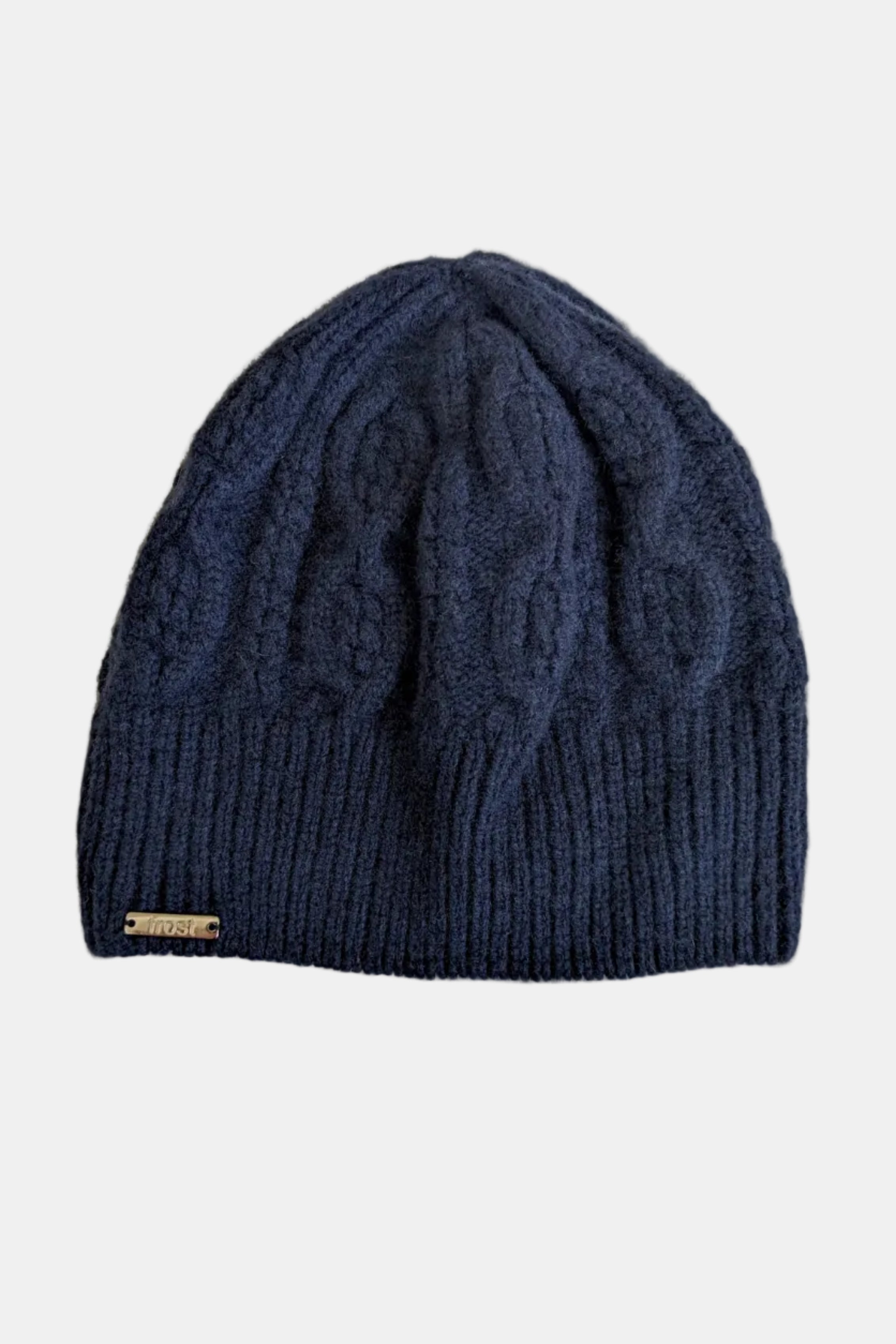 Blue knitted beanie with cable pattern on a white background