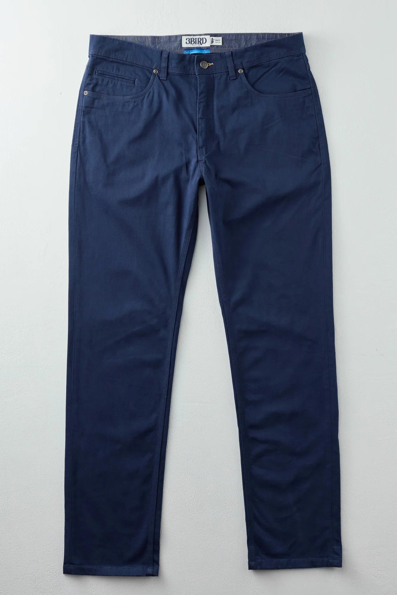 Blue jeans on a light gray background