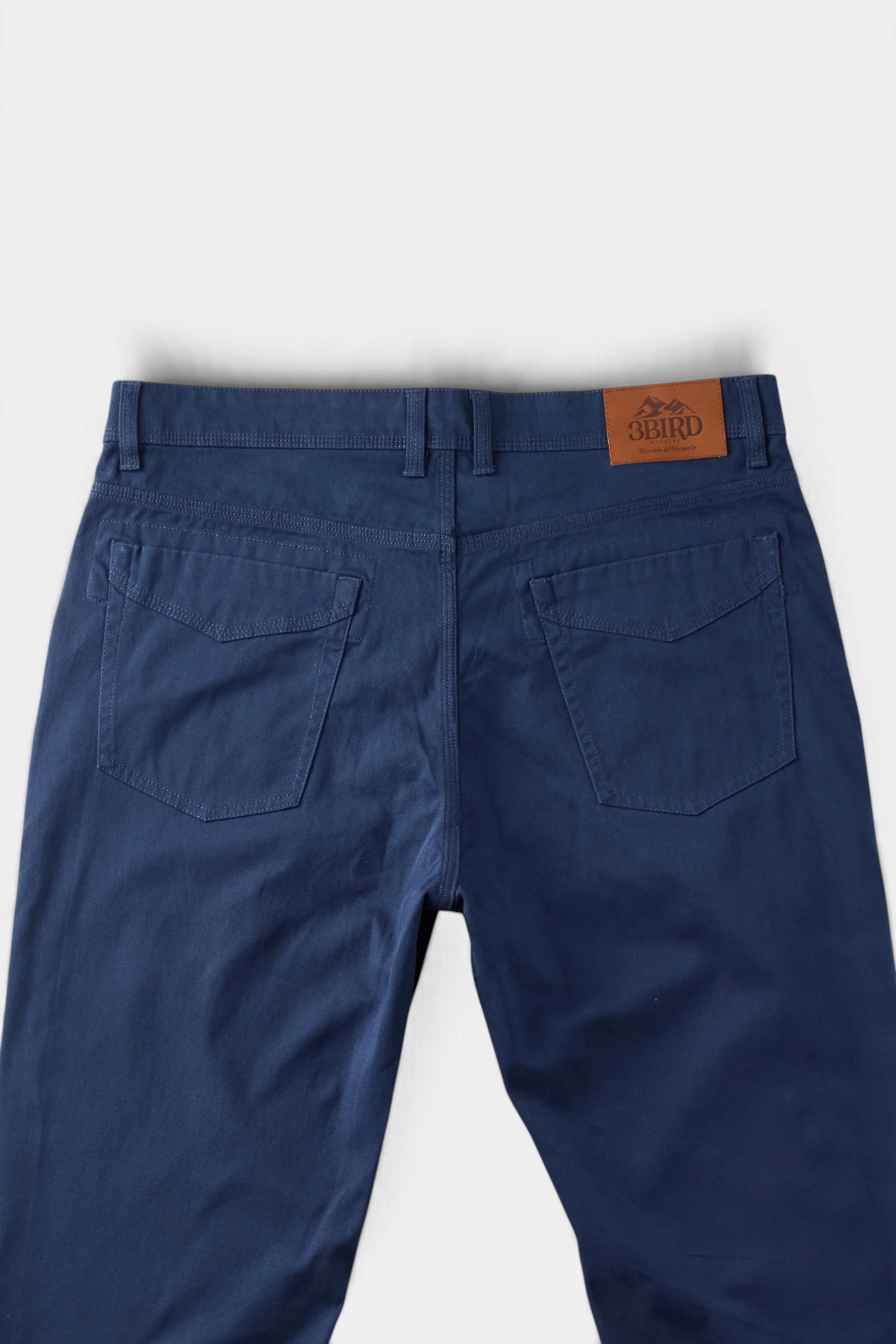 The Copper Shed Breakout broken twill pants in navy blue with reinforced back pockets and a leather brand patch.