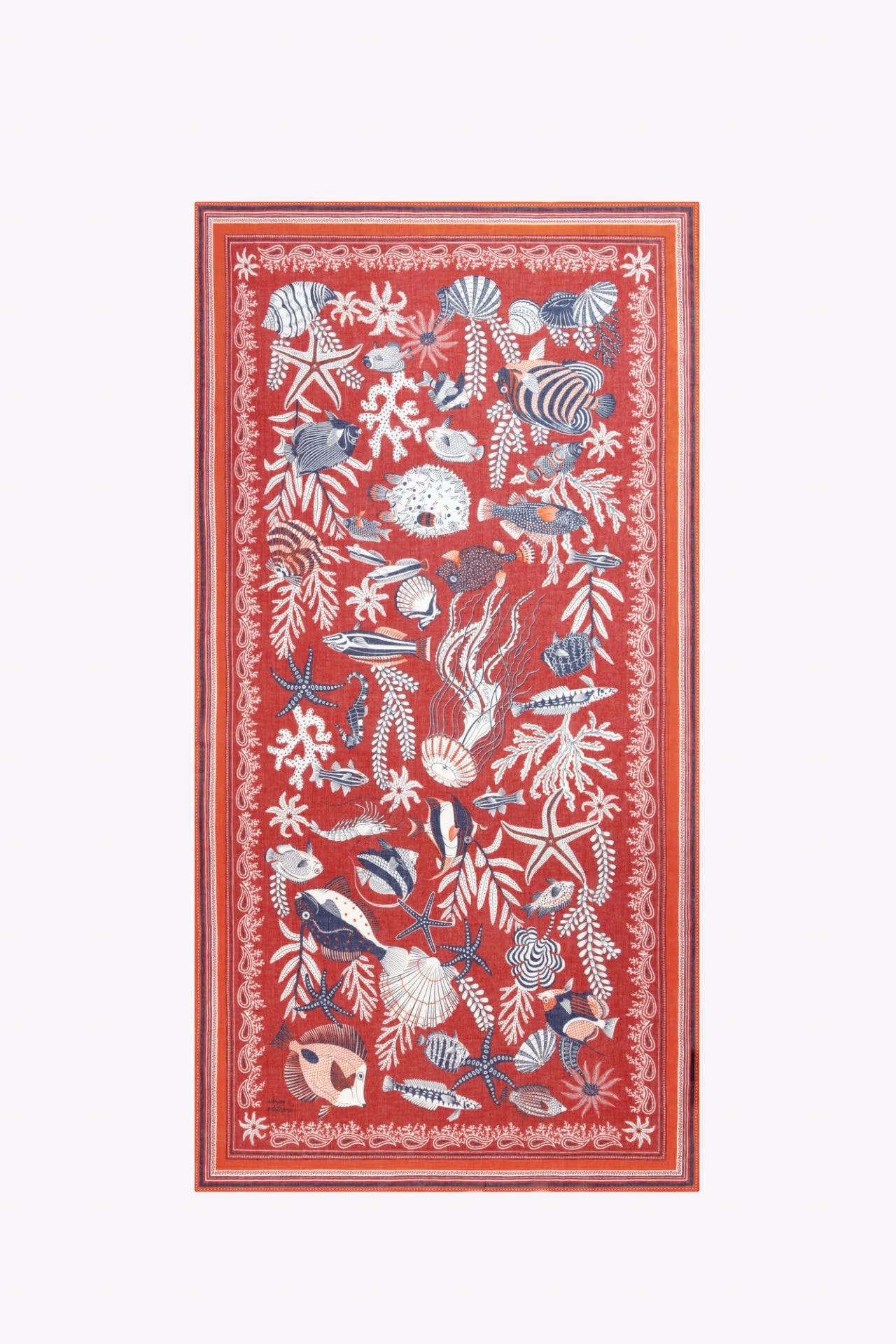 Decorative rug with marine life pattern on a red background