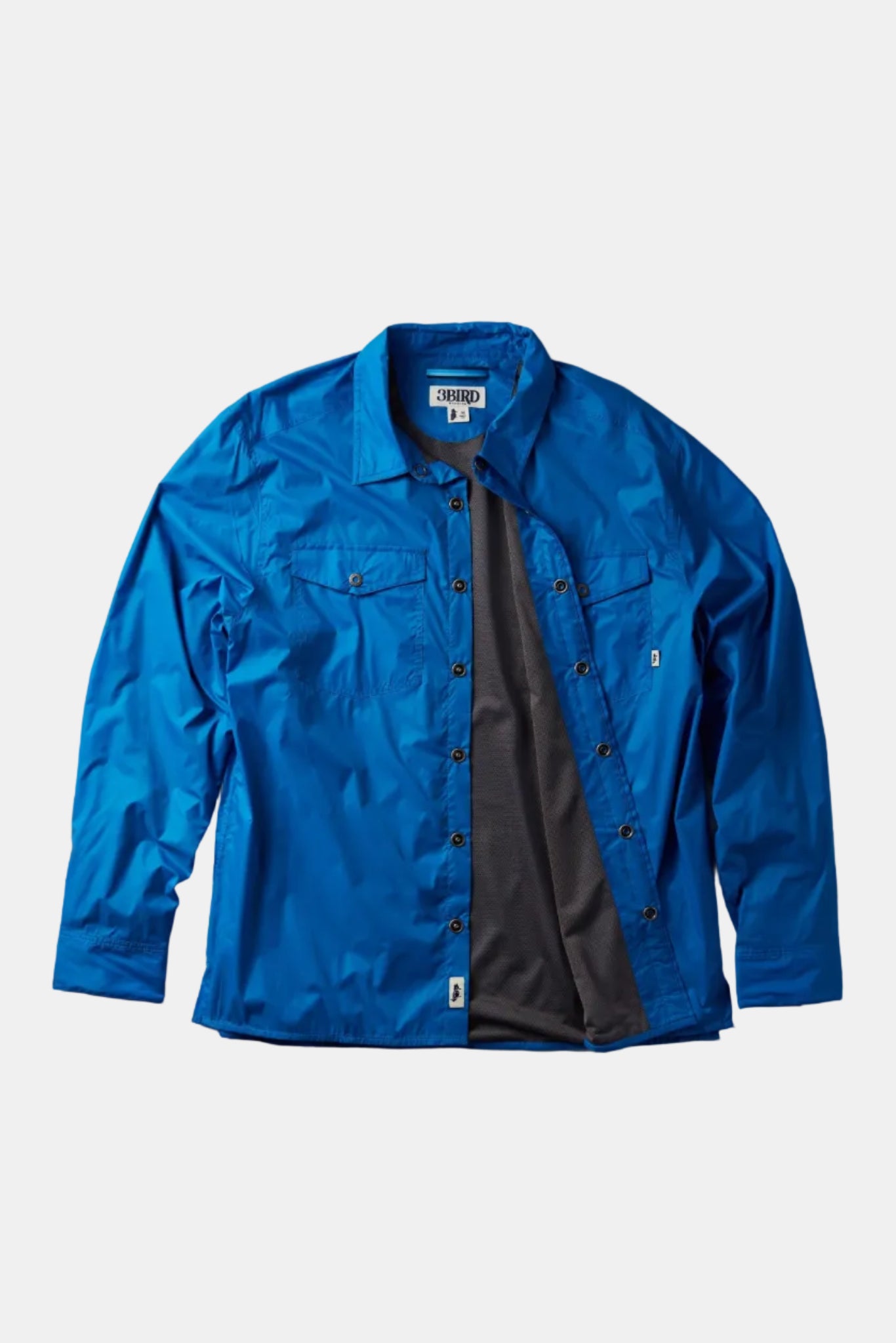Blue jacket with a brand label on a gray background