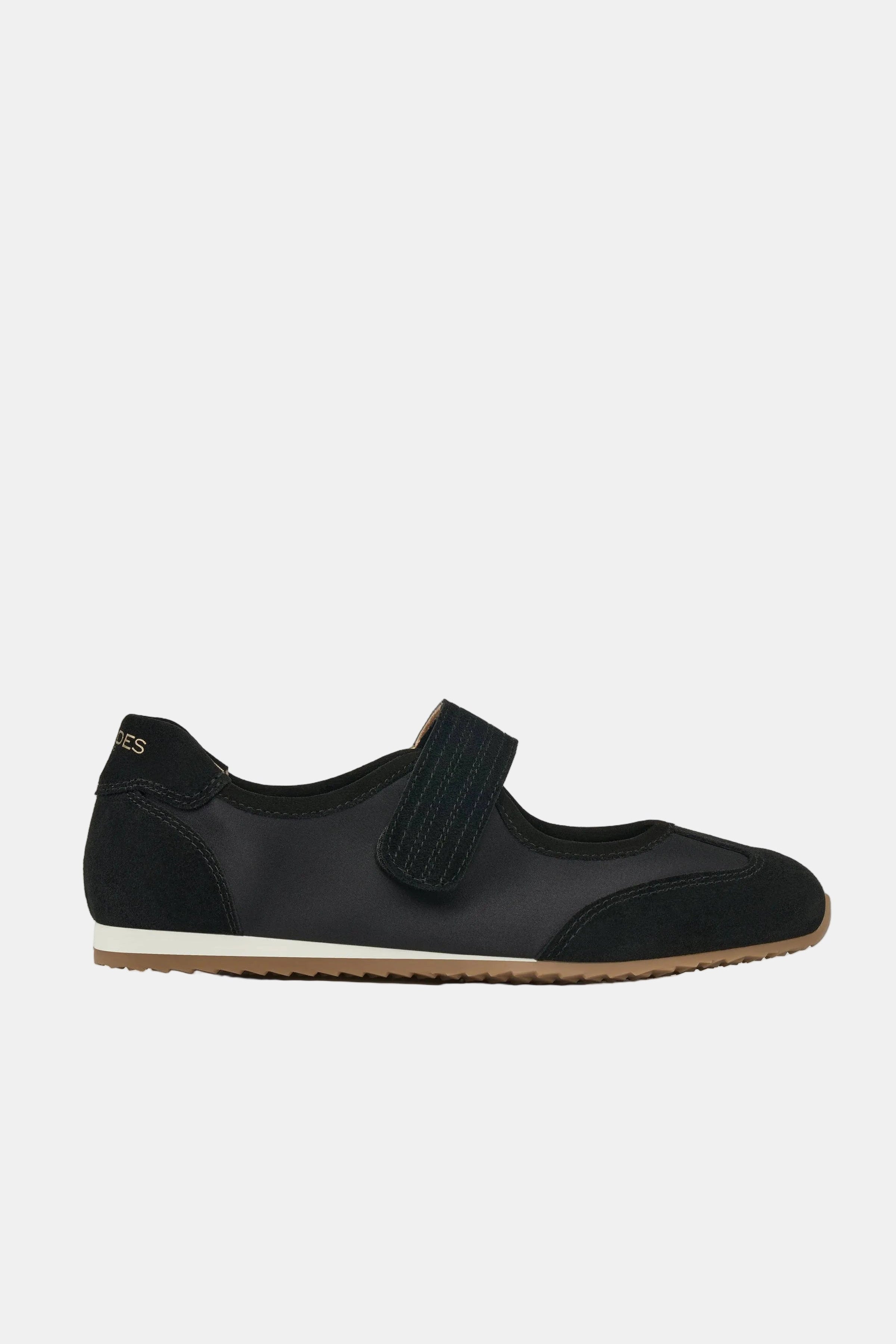 Black sneaker with floral pattern on sole against a white background