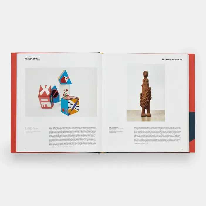 Open book showing ceramic sculptures on a white background