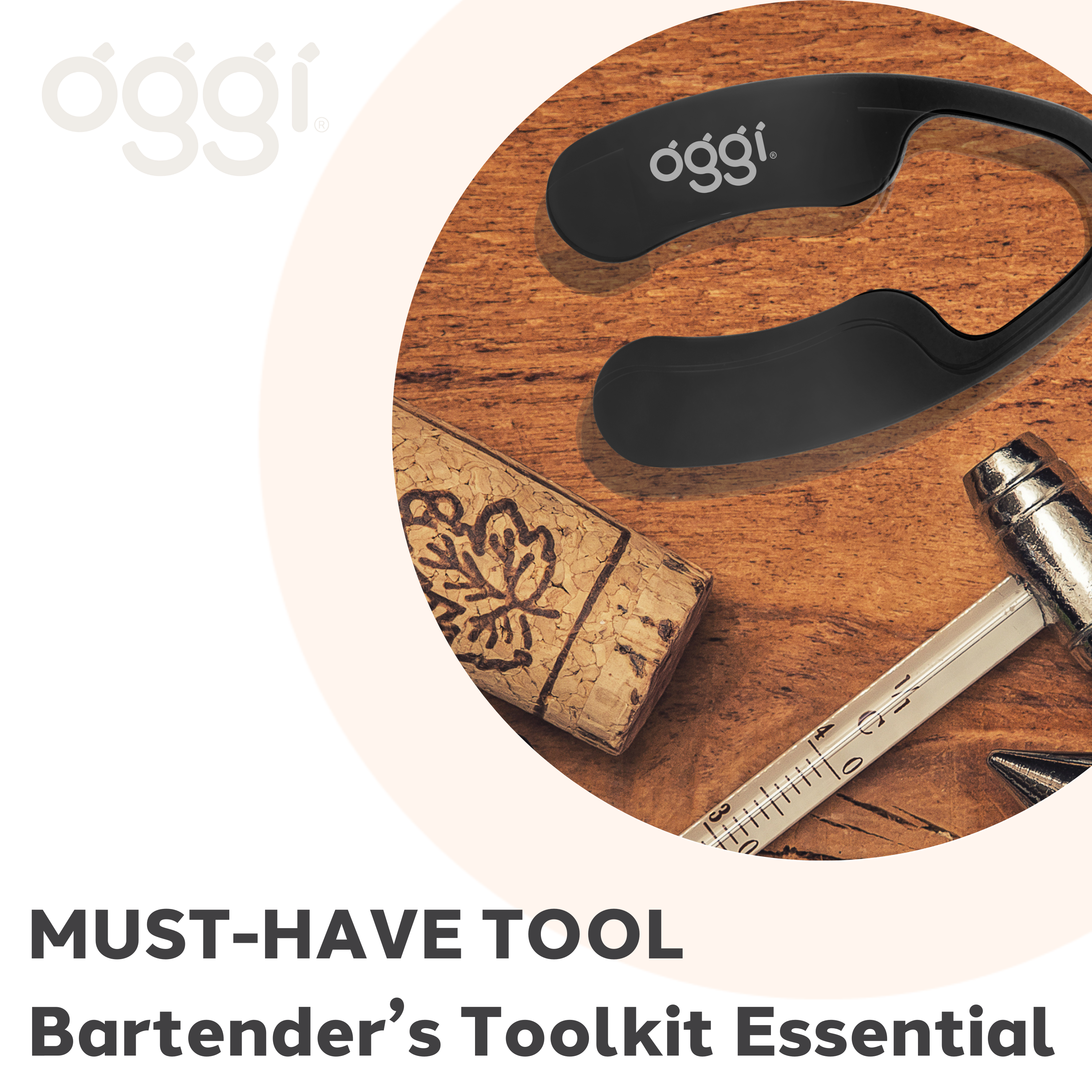 Bartender's toolkit essential with black tool, cork, and knife on a wooden surface, featuring the oggi brand.