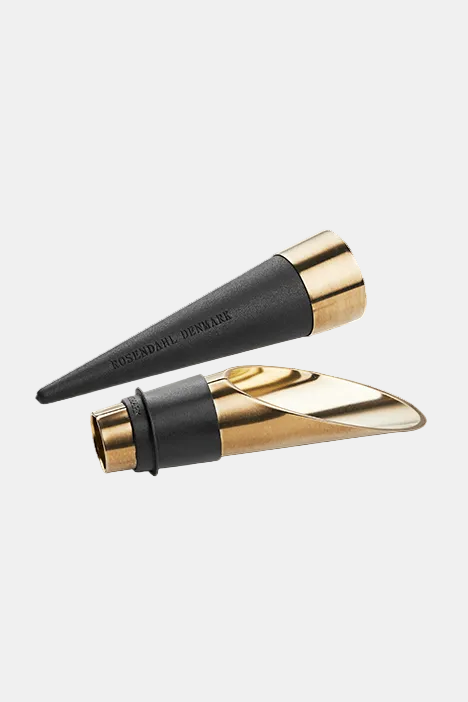 Black and gold lipstick case on a transparent background