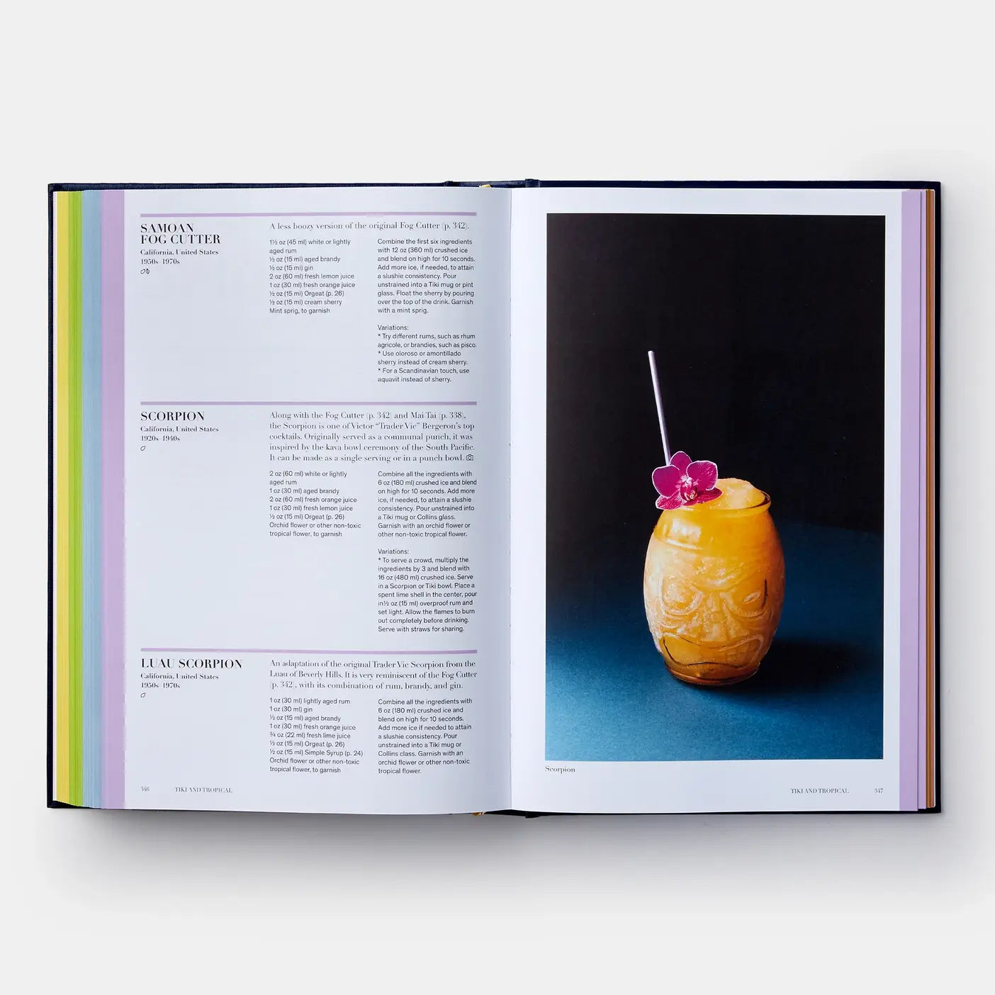 Open book with a colorful drink on a blue surface and text on a white background