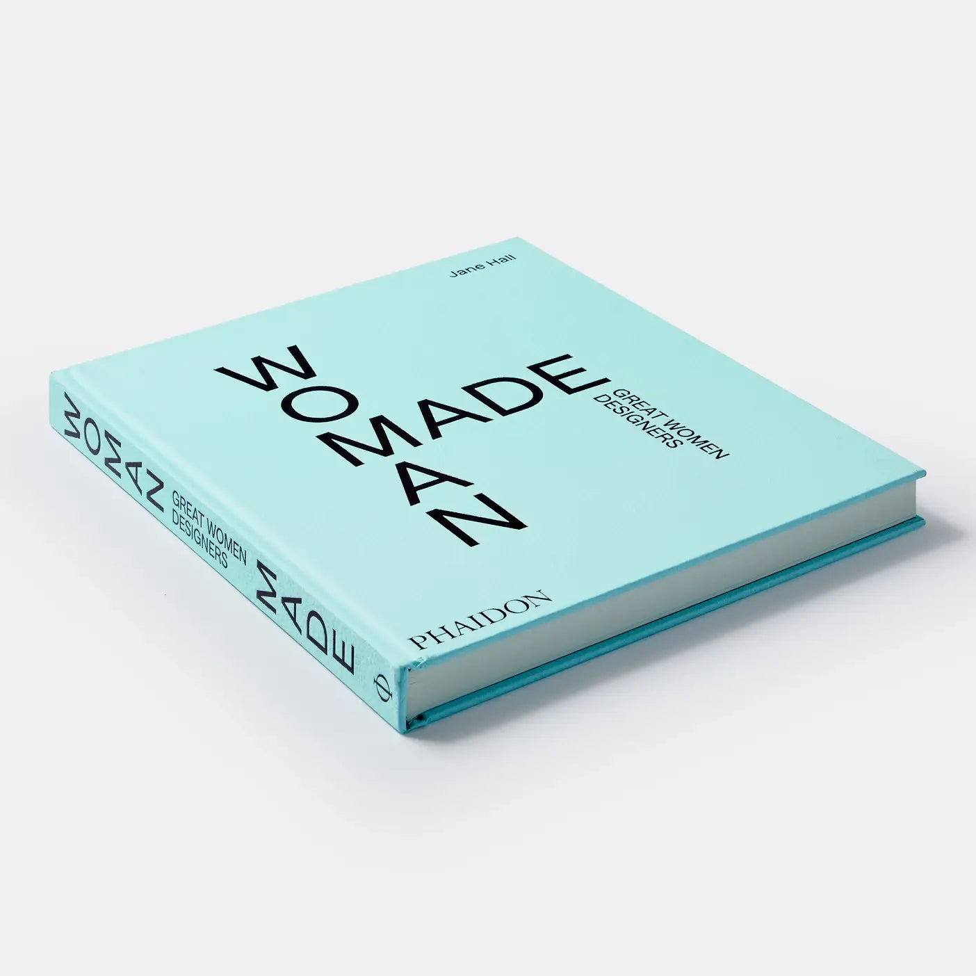 Book titled 'We Made A Man' by Oscar Niemeyer on a light blue background