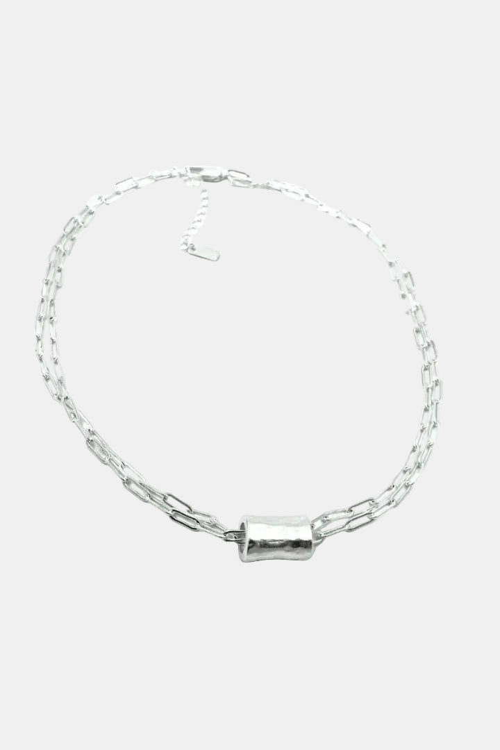 Silver chain bracelet on a white background