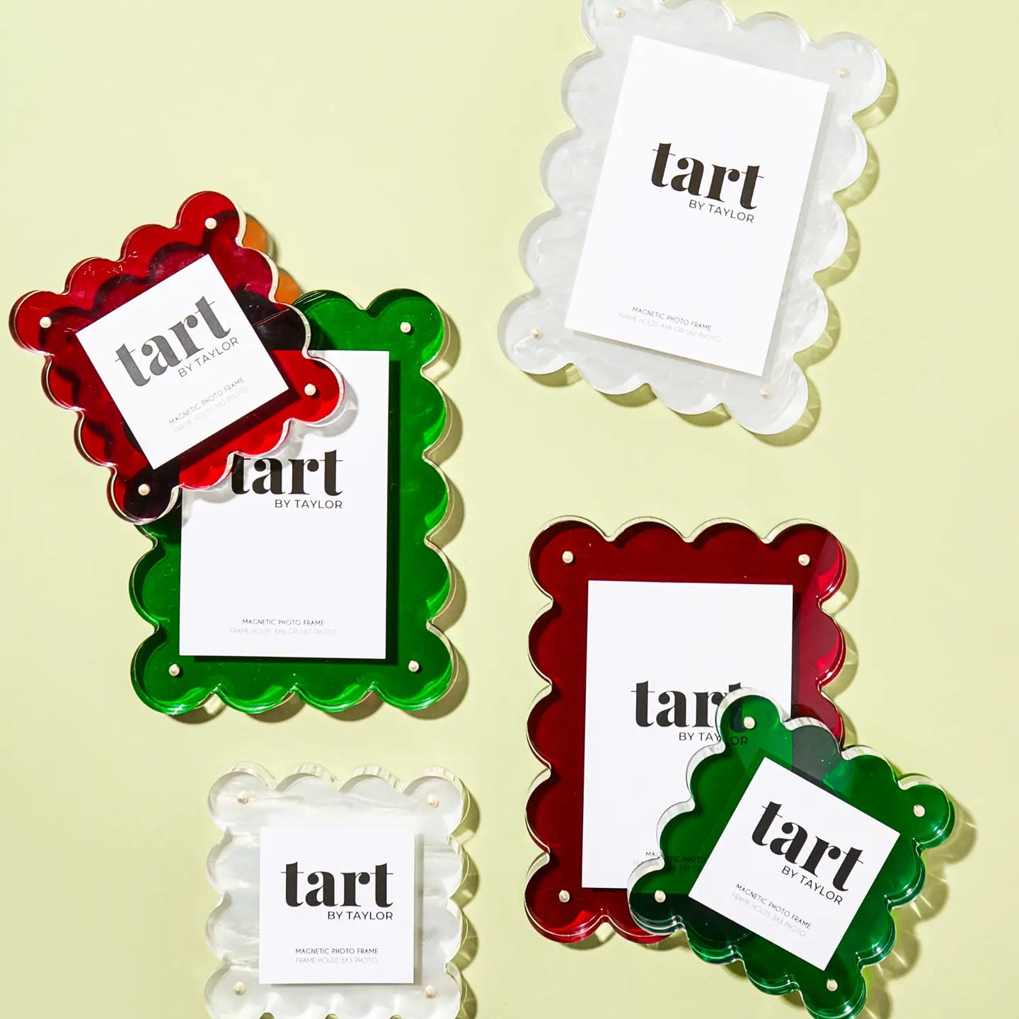 Decorative frames with 'tart by Taylor' labels on a light yellow background