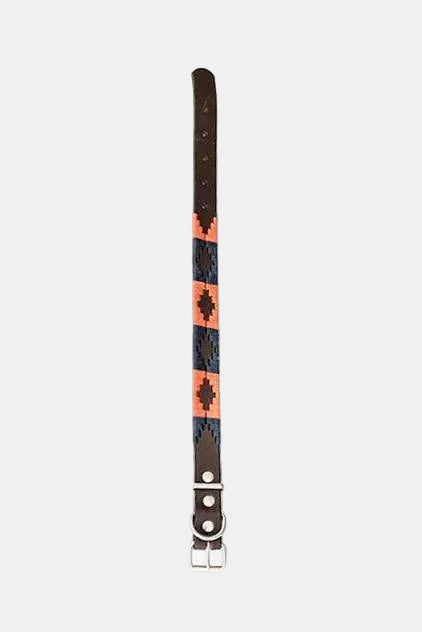 Bracelet with a patterned band and metal clasp on a white background
