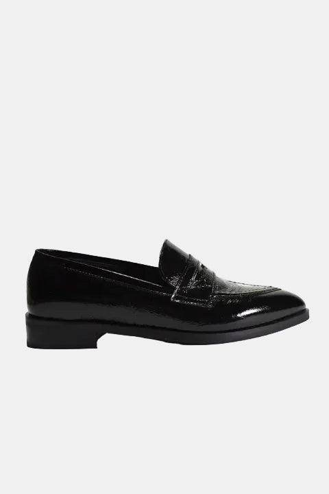 Pair of black loafers on a white background
