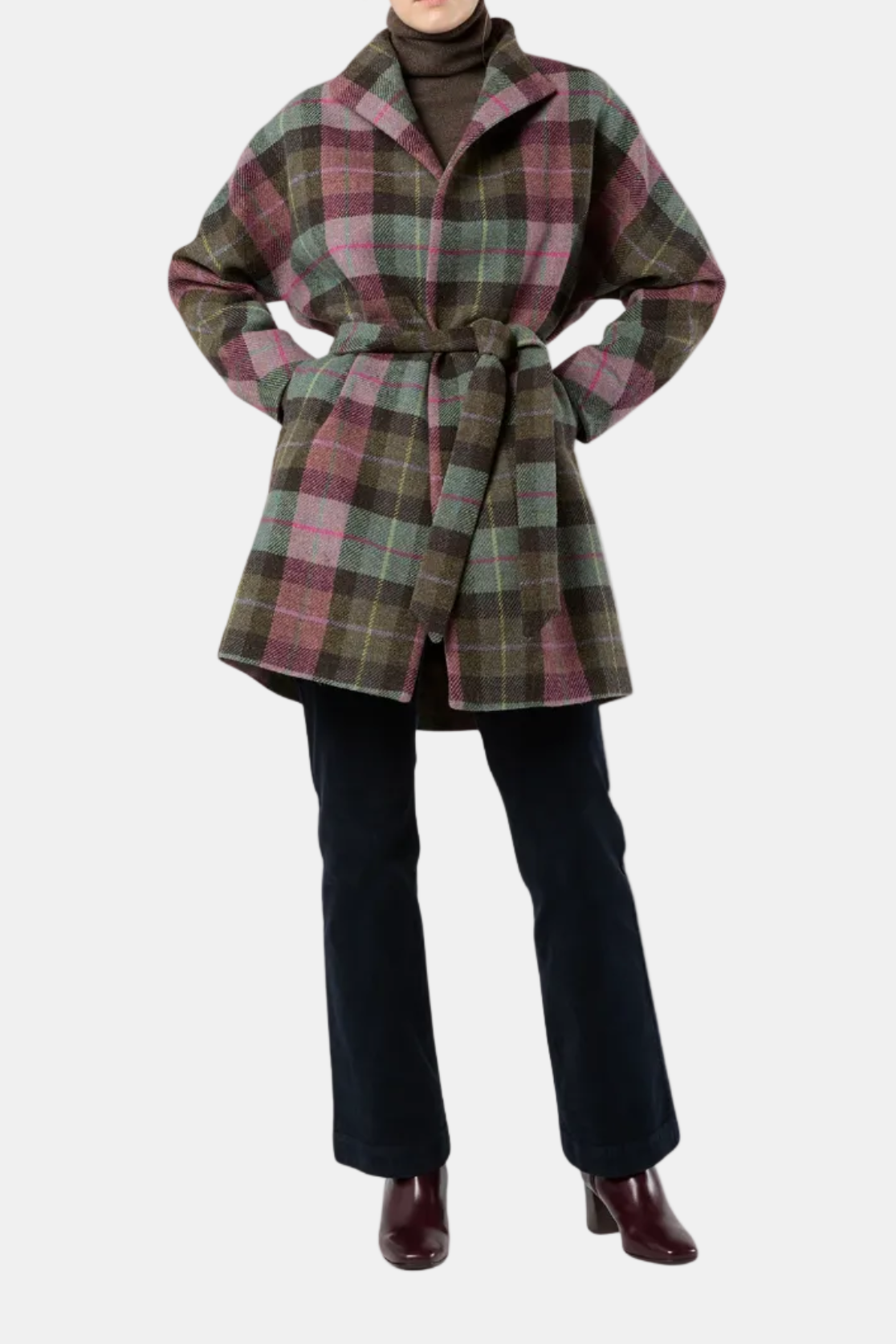 Person wearing a plaid coat on a white background
