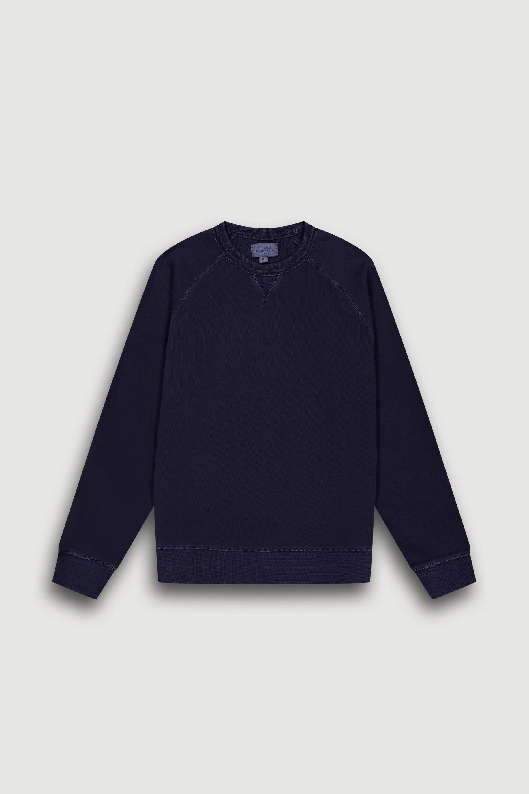 Navy blue sweatshirt on a light gray background