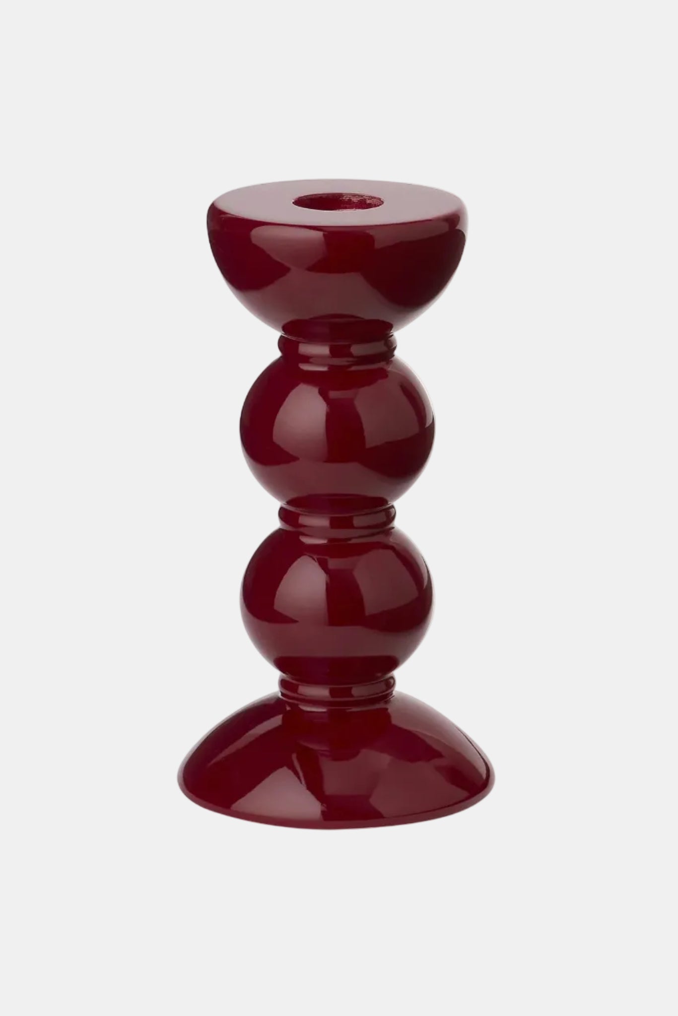 Red candle holder on a white background