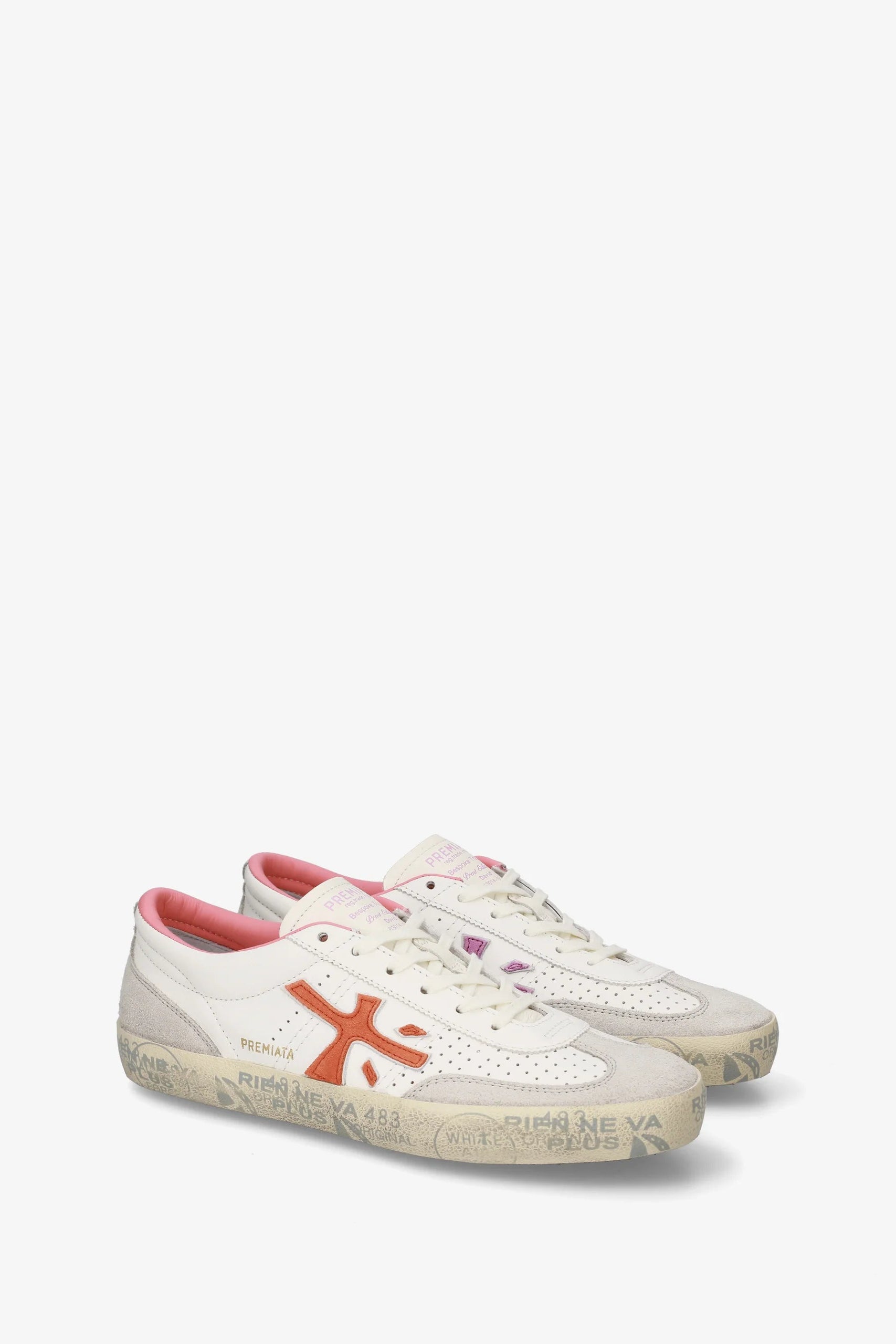 White sneakers with red accents on a white background