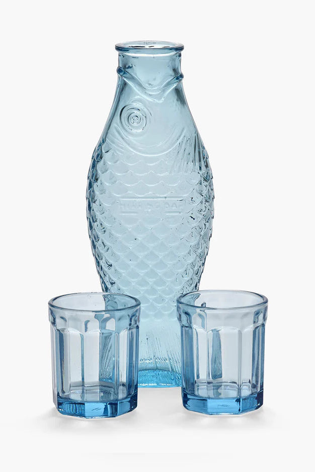Blue glass carafe and two glasses on a white background