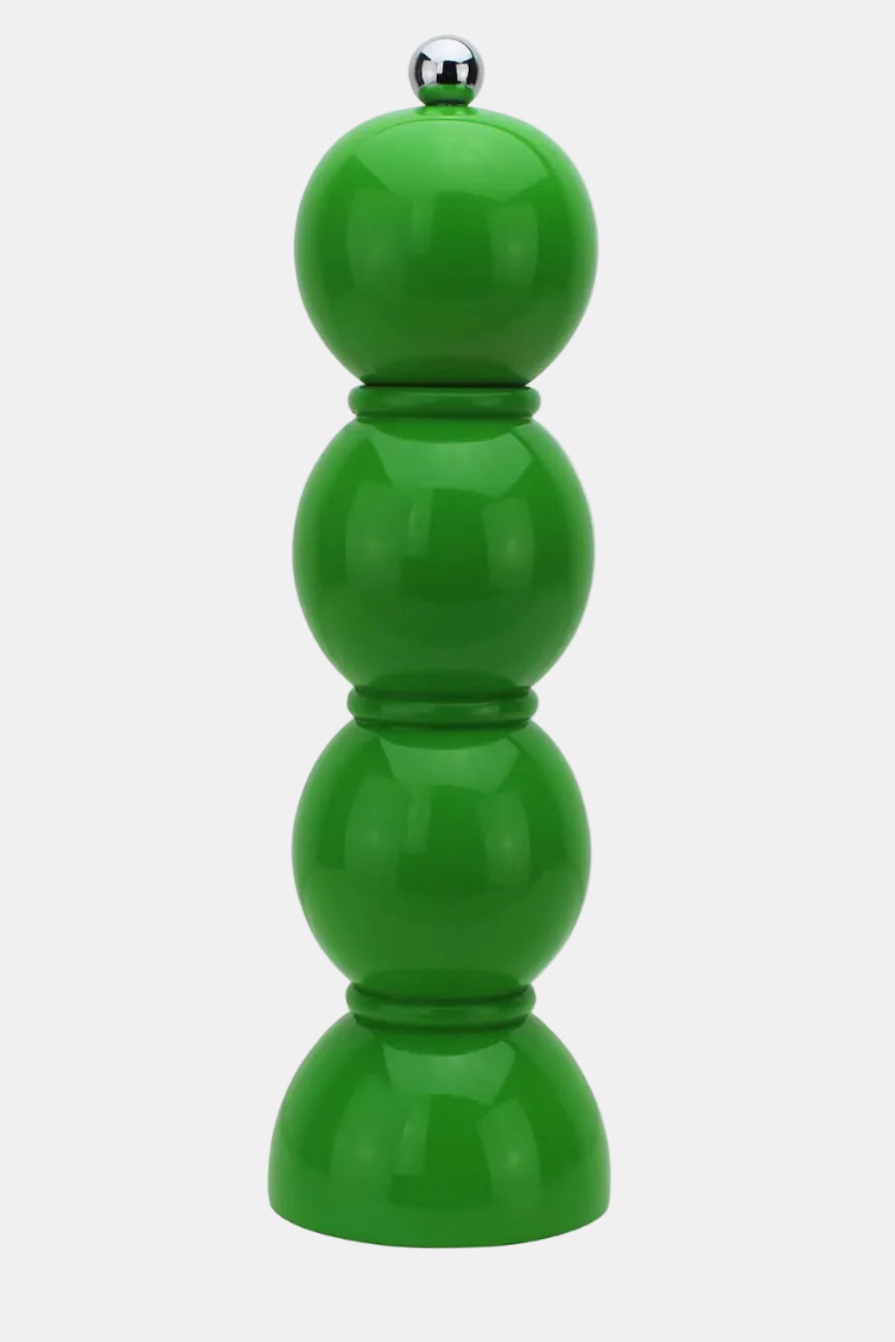 Green pepper grinder on a white background