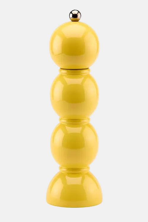 A glossy yellow pepper mill with a stacked, rounded design and a small metallic silver ball on top, set against a plain white background.