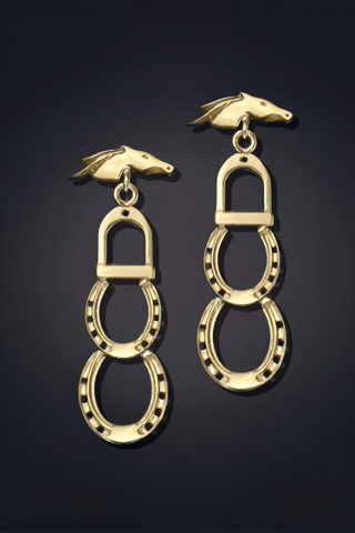 A pair of gold-colored earrings in the shape of horseshoes, with intricate details and a hook at the top for attachment.