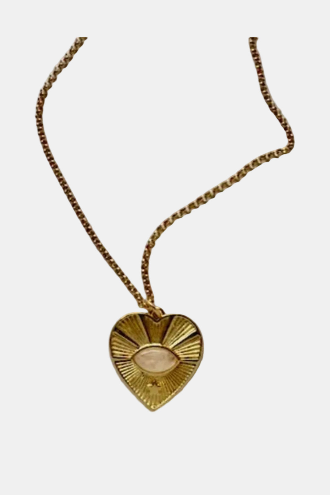 Gold heart-shaped pendant necklace on a light gray background