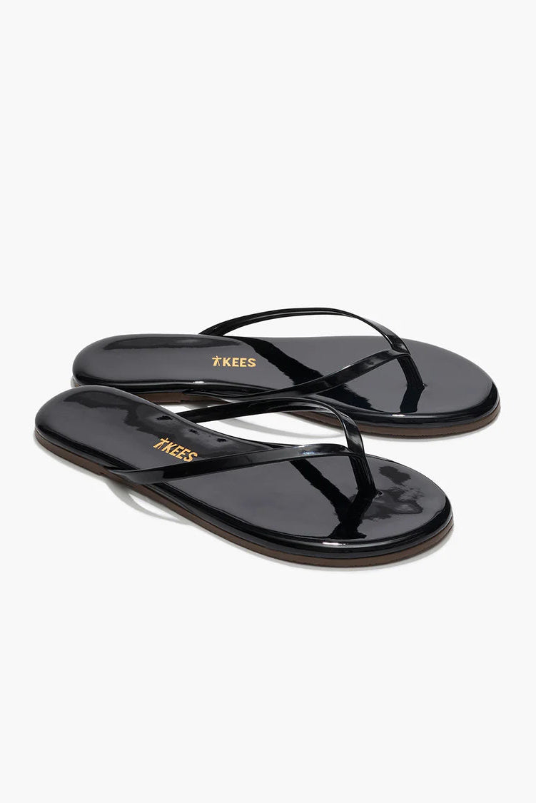 Black sandals with 'Tkess' branding on a white background