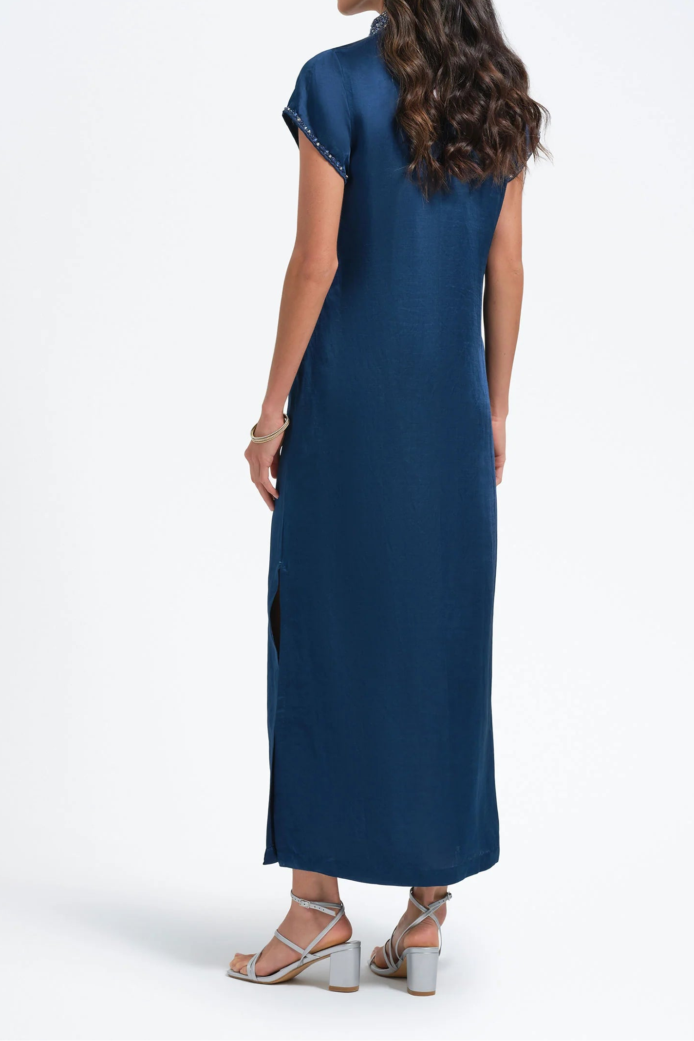 Woman wearing a blue dress on a white background
