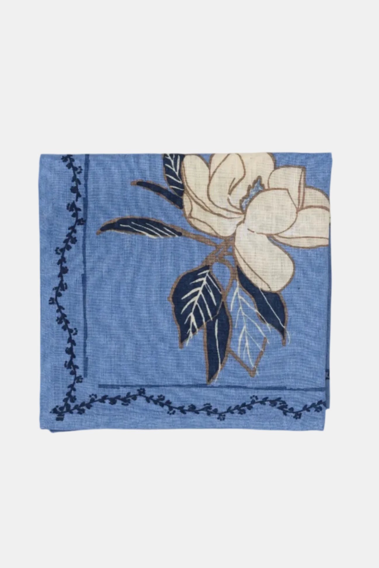 Blue fabric square with floral design on a beige background
