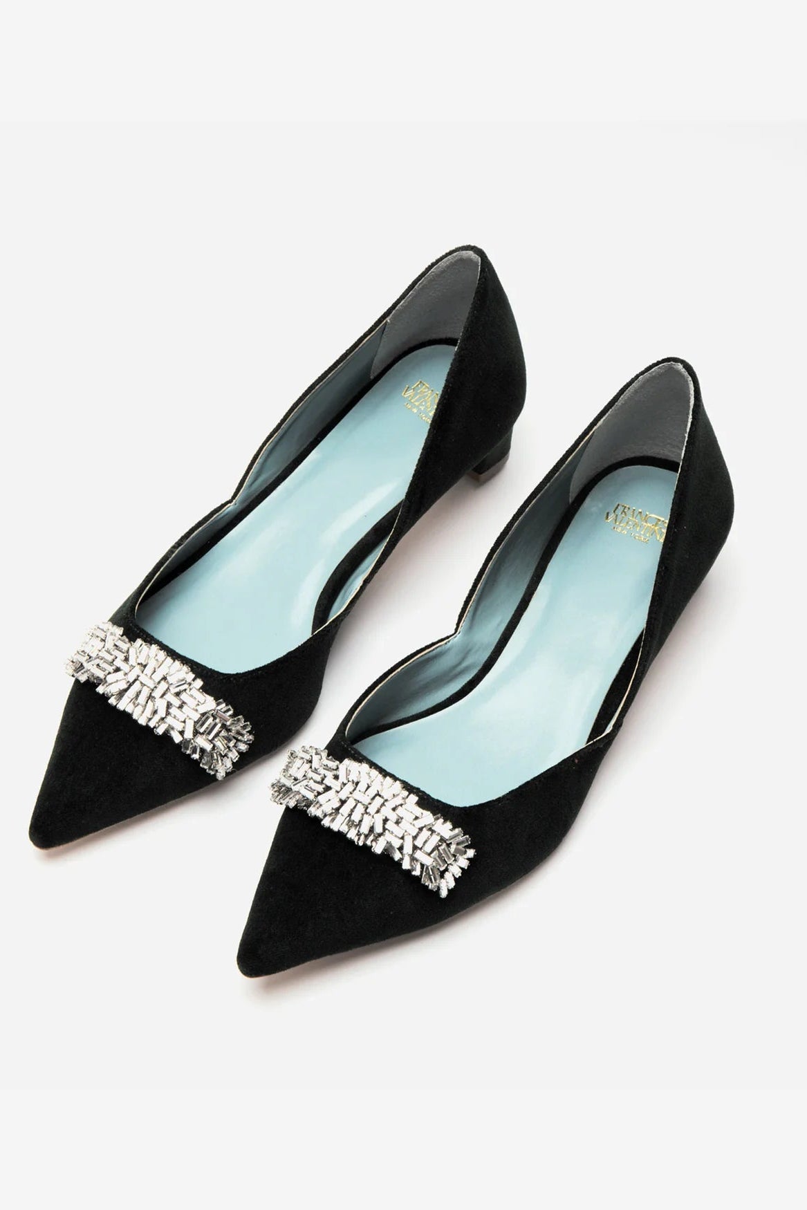 Black pointed-toe shoes with crystal embellishments on a white background