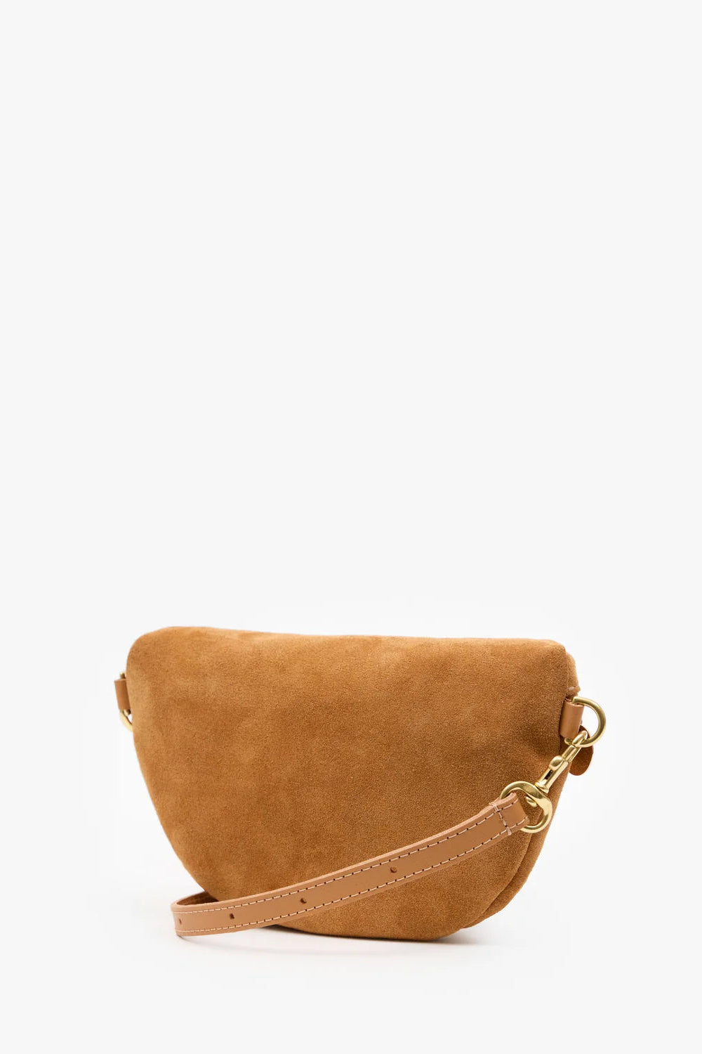 A small camel-colored suede crescent-shaped shoulder bag with a tan leather strap and gold-tone hardware, photographed on a clean white background.