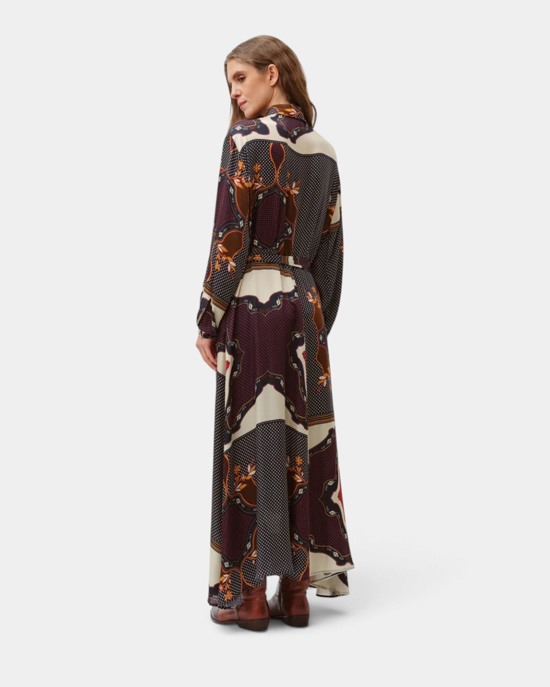 The Copper Shed Riora silk blend midi dress in black and multicolored print with long sleeves and a waist tie