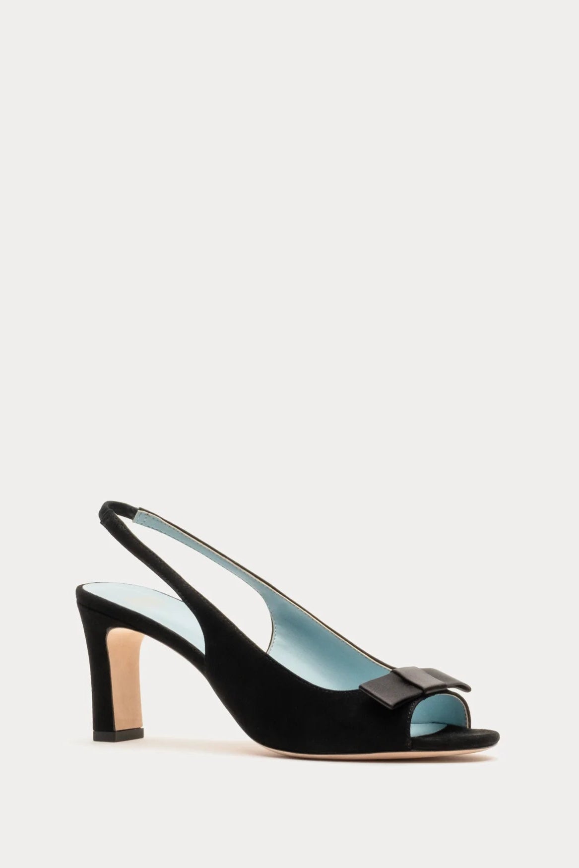 Black sandal with a bow on a light gray background
