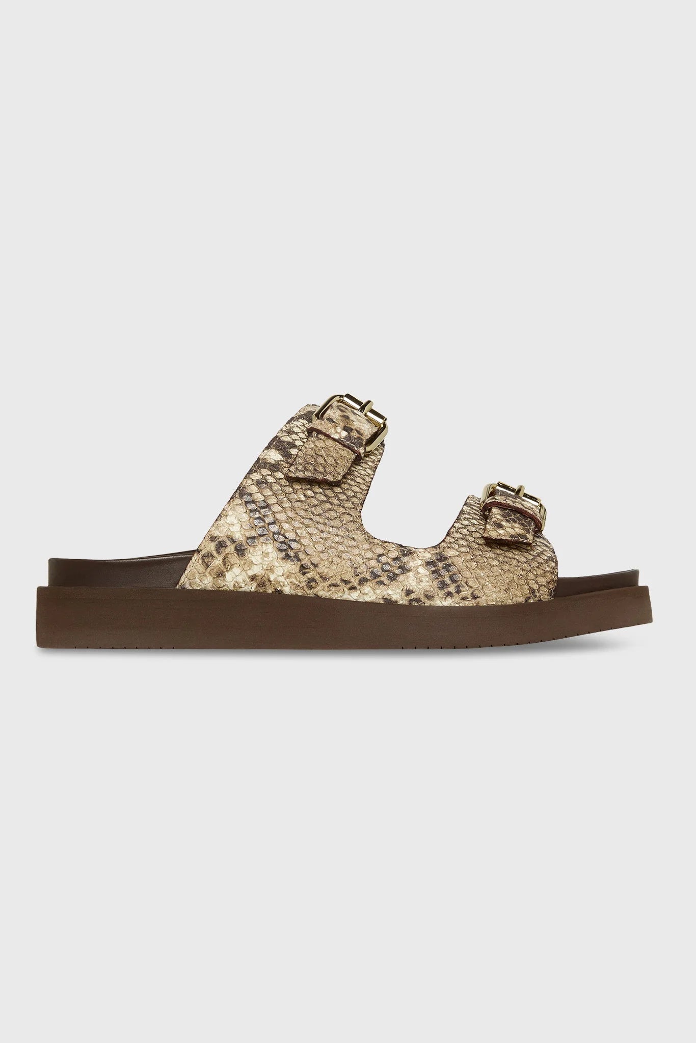 Snake print sandal with brown sole on a light gray background