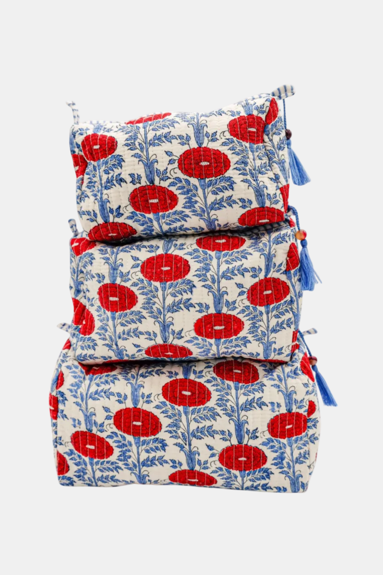 Set of three fabric bags with red floral pattern on a white background
