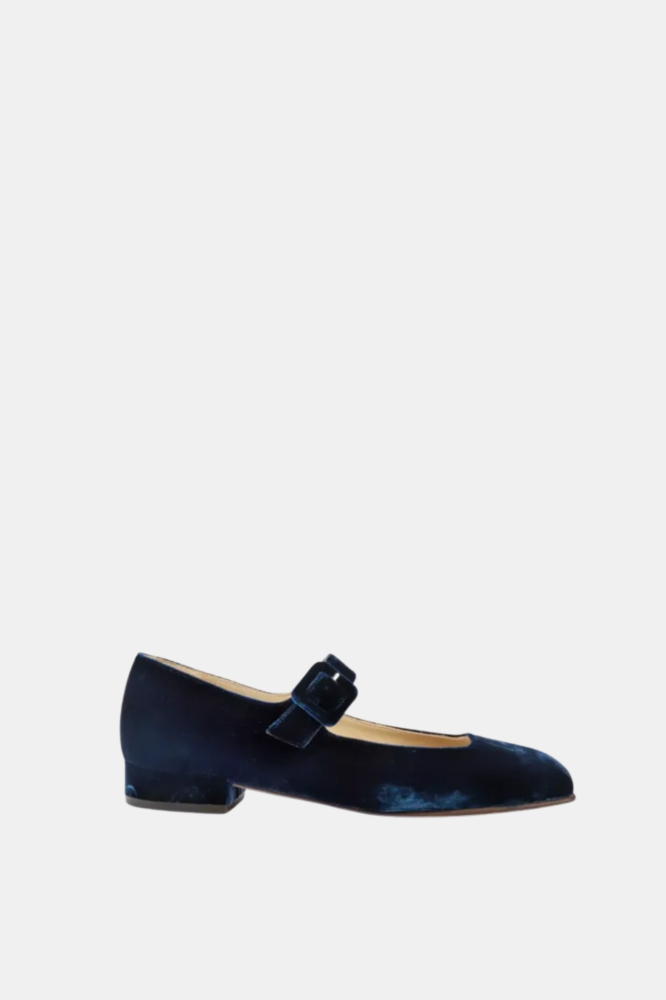 Navy blue velvet shoe with a bow on a white background