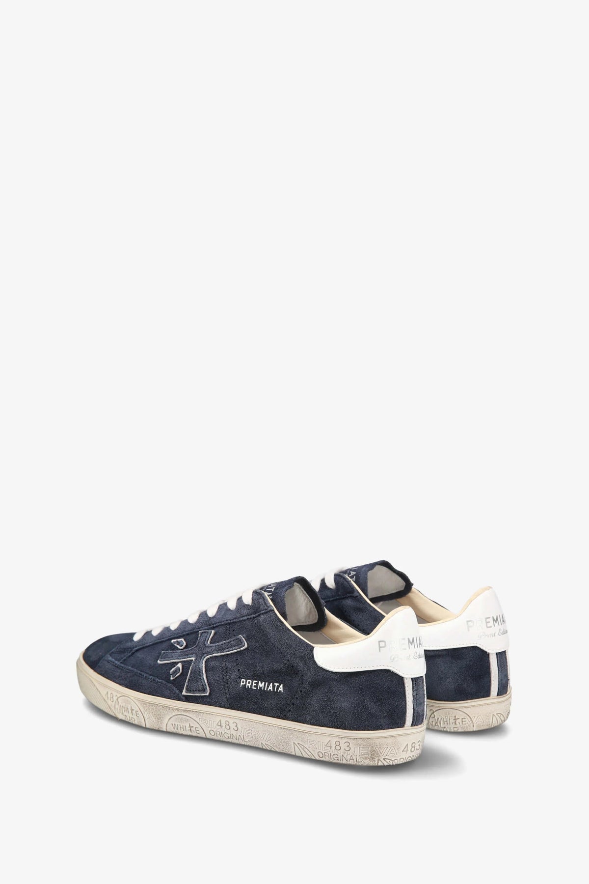 Navy and white sneakers on a white background