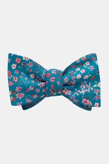 Floral-patterned bow tie on a blue background