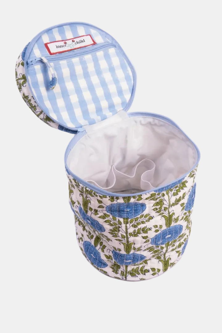 Fabric storage bin with floral design and striped lid on a white background