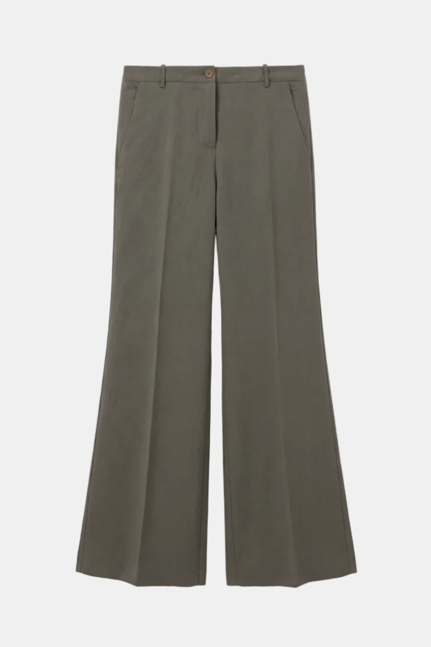 Green wide-leg pants on a light gray background