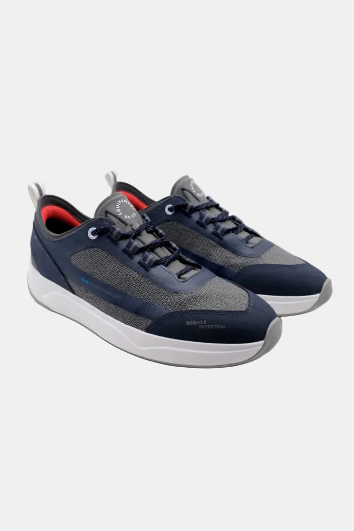 Navy and gray sneakers with white soles on a white background