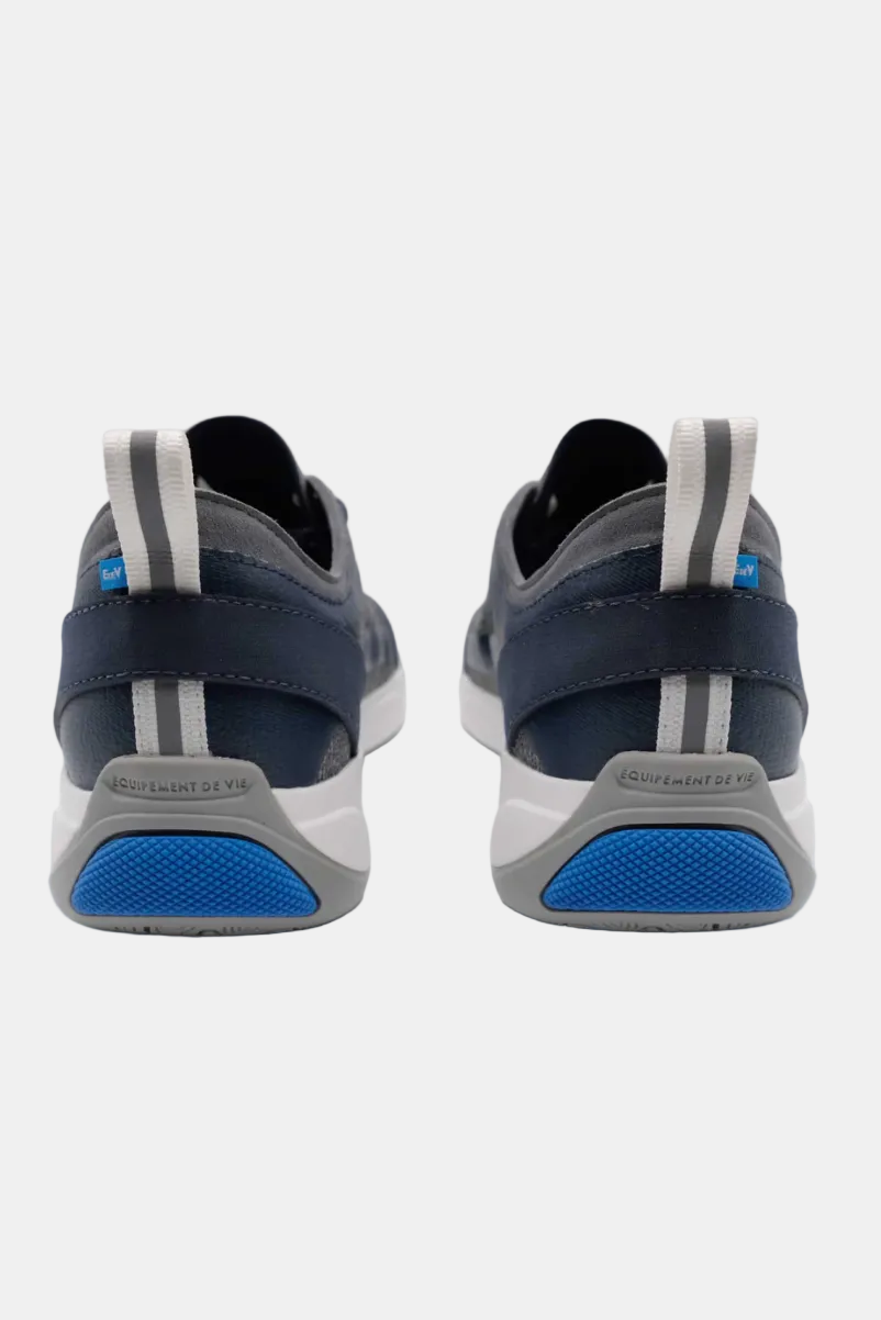 Navy and gray sneakers with blue soles on a white background