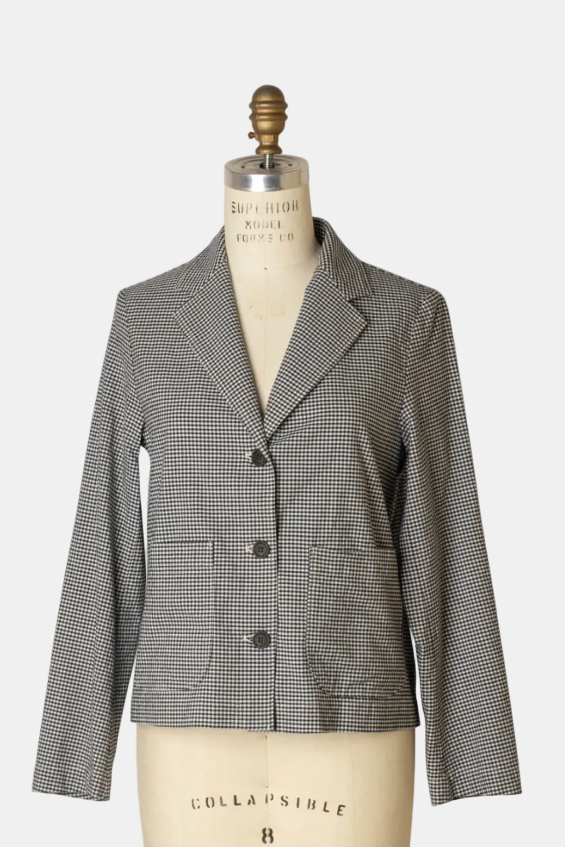 Houndstooth patterned blazer on a mannequin against a white background