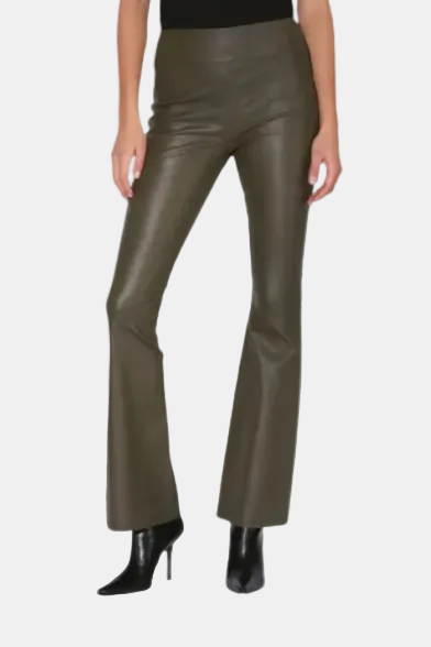 A pair of olive green leather pants with a high waist and boot cut design, worn by a model with black boots.